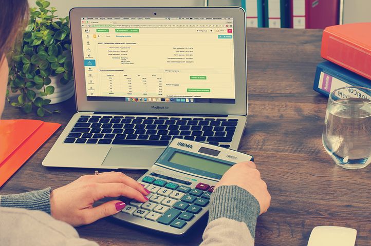 accountant computing with a calculator