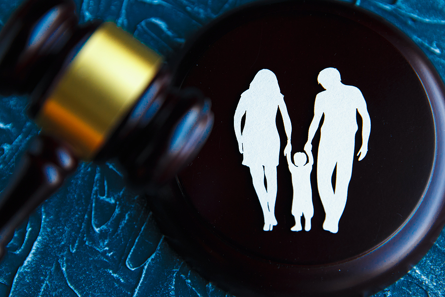 Cutout family imagery and a gavel. Child-custody and family law in Sydney concept.